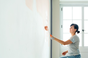 woman painting a wall